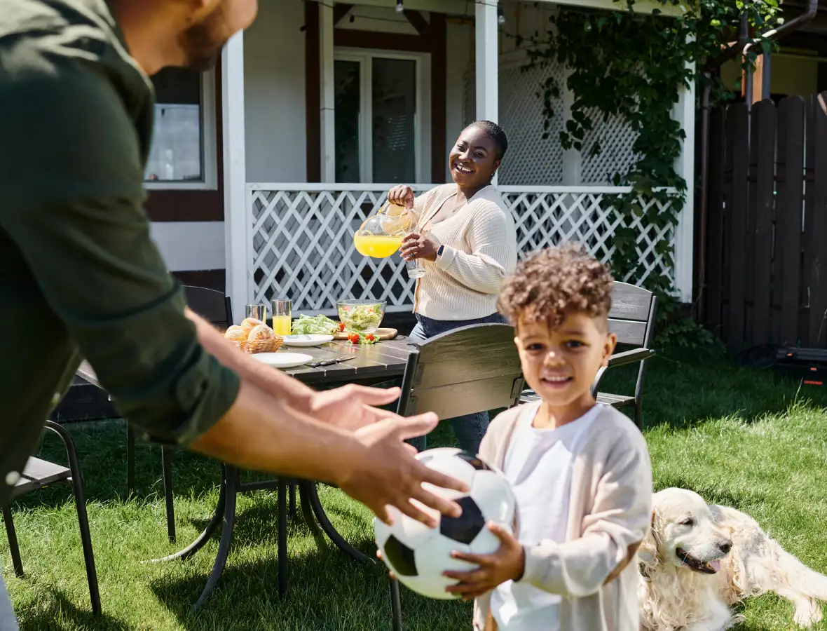 Family playing in their back lawn