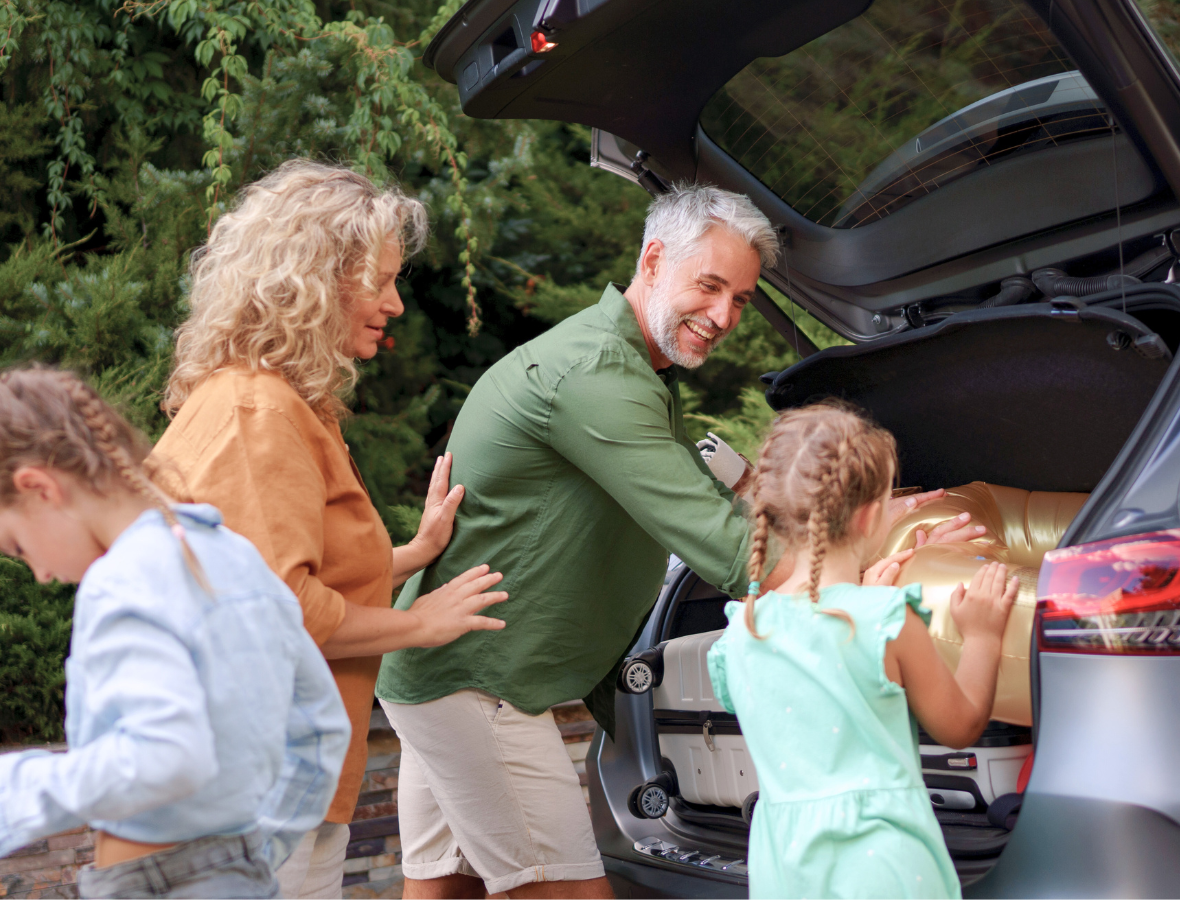 Family packing bags into their car