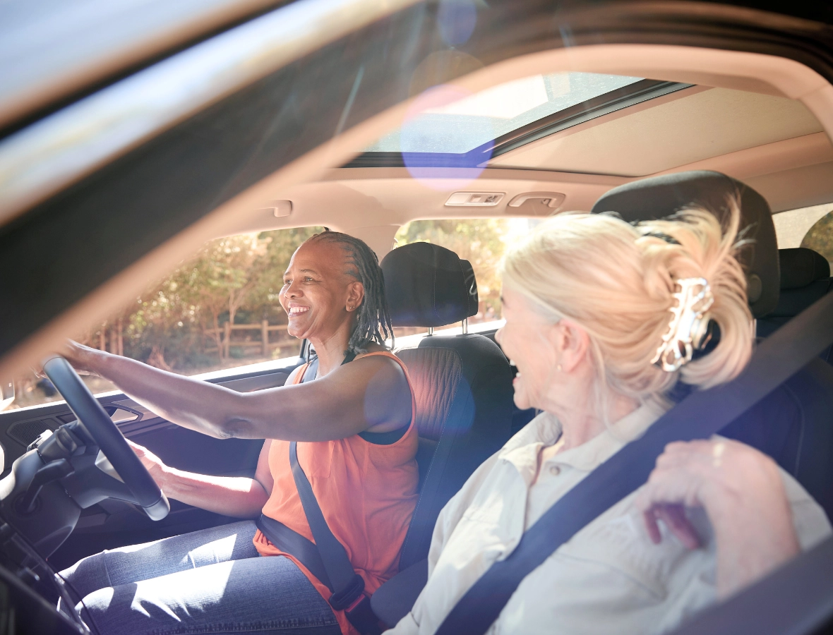 Two women in the car smiling