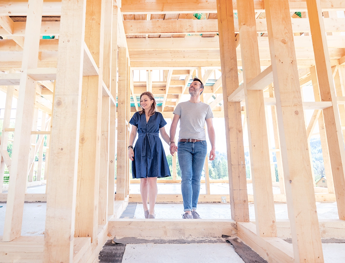 First-time homebuyer couple walks through new build.