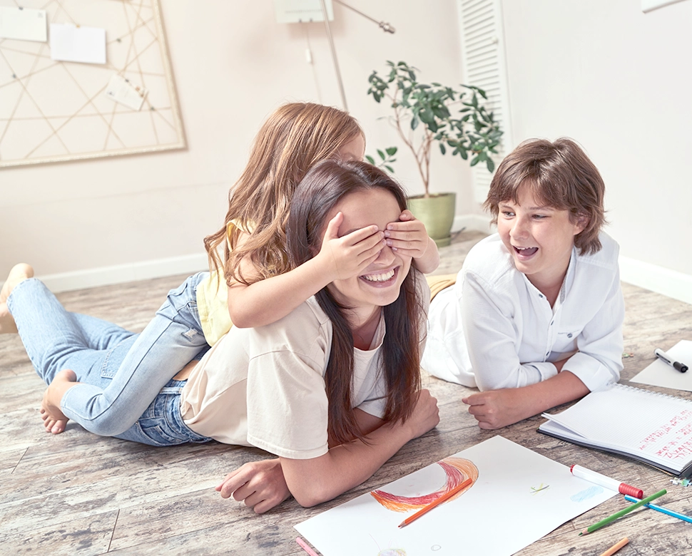 Educational employee enjoying family time after purchasing dream home with teacher and staff home loan.