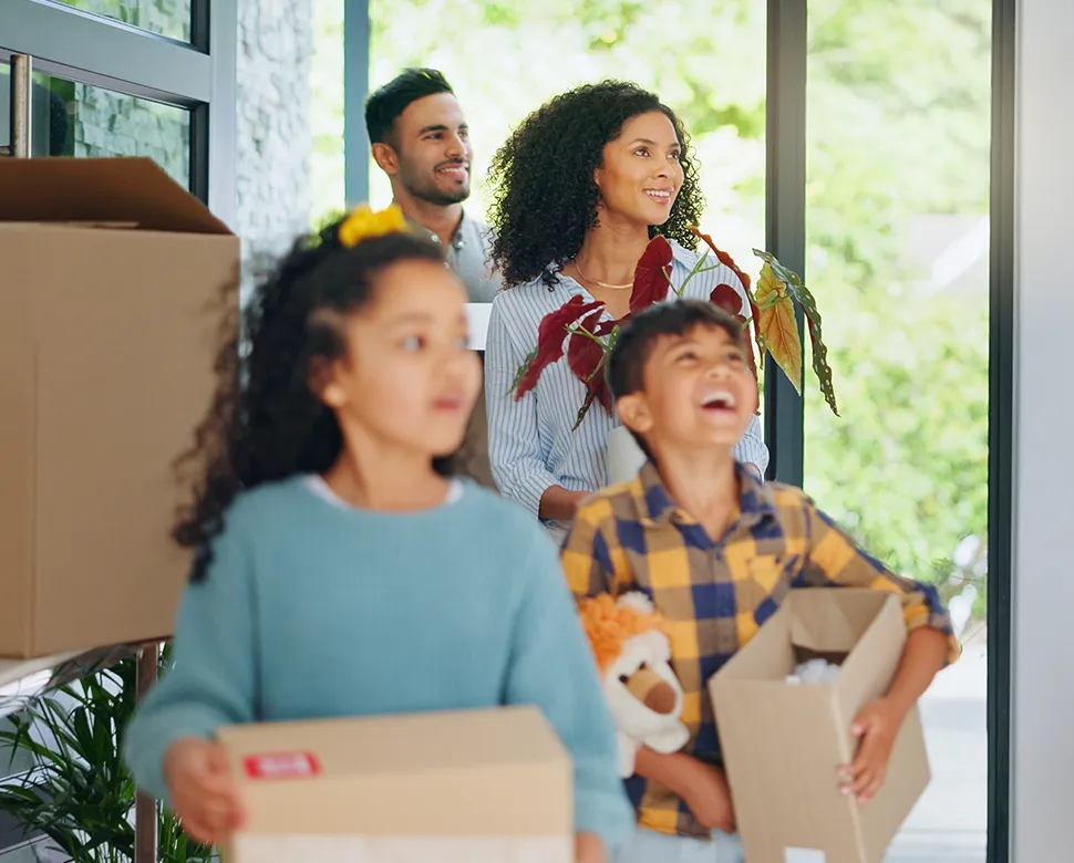 Happy family with moving boxes