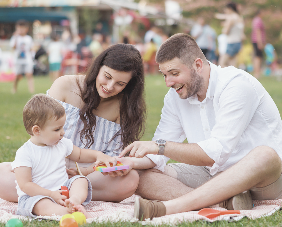 Parents having a picnic with their baby