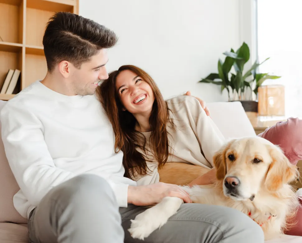 Couple on couch with their dog