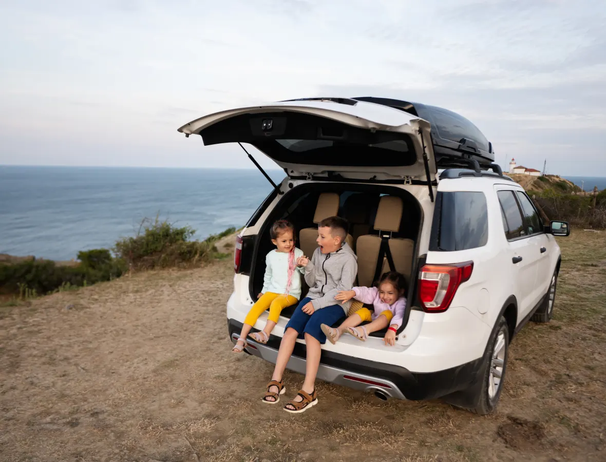 Family having lunch in the back of their car