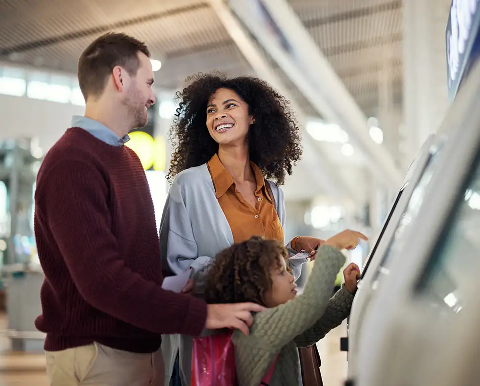 Couple reviewing car in showroom