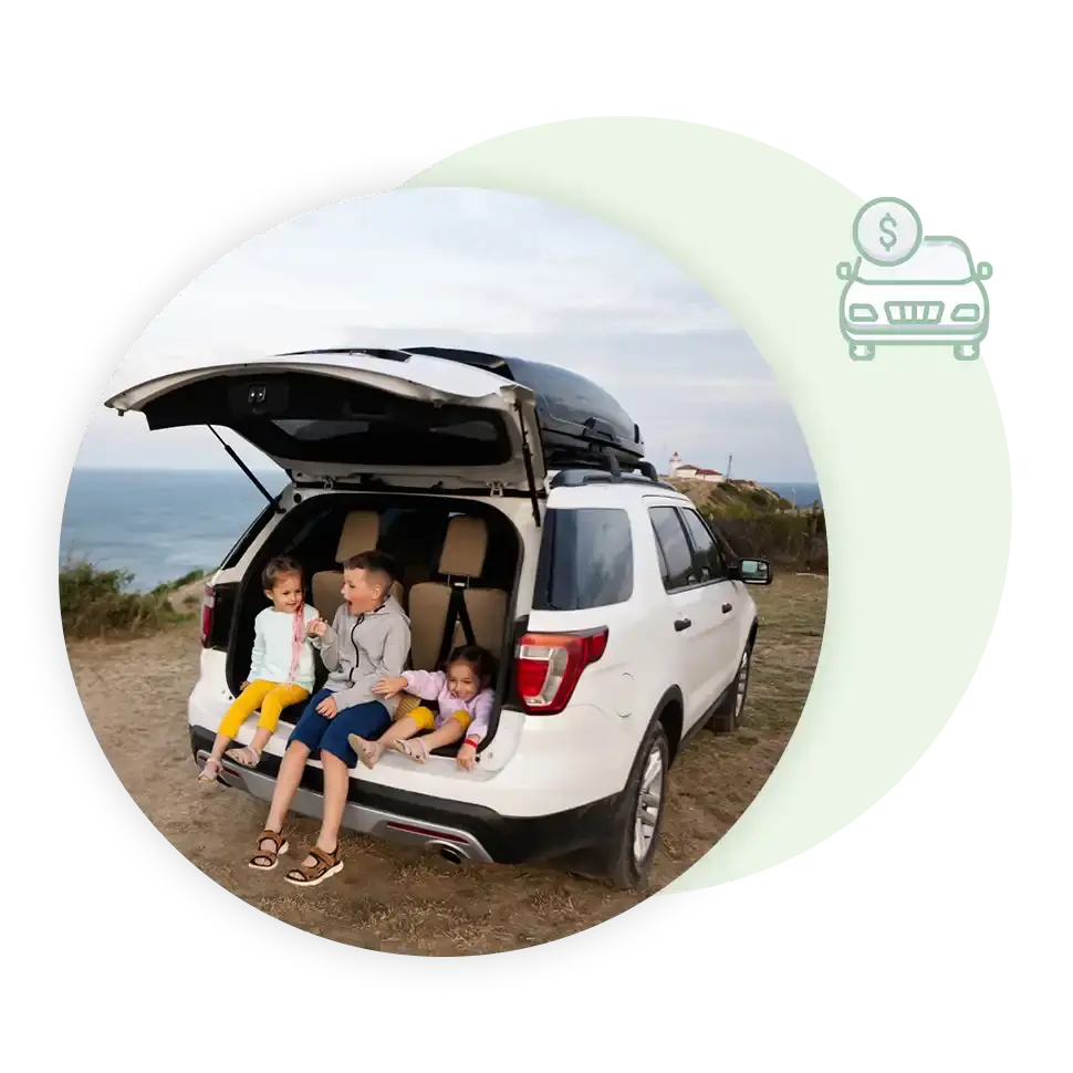 family enjoying lunch in the back of their car