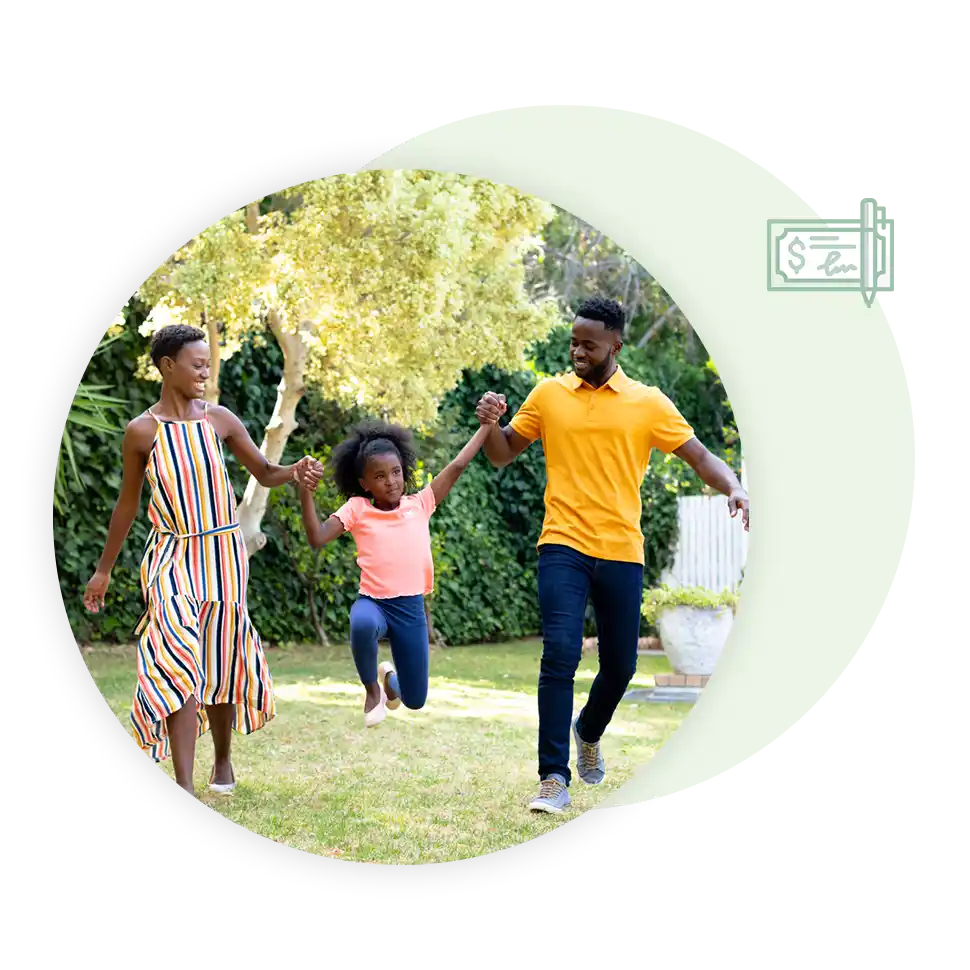 Mother, father, and their daughter playing in the backyard