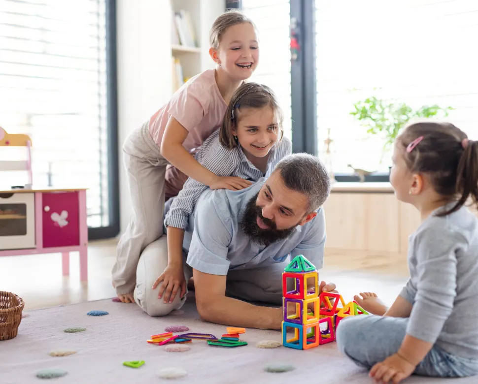 Family playing on floor